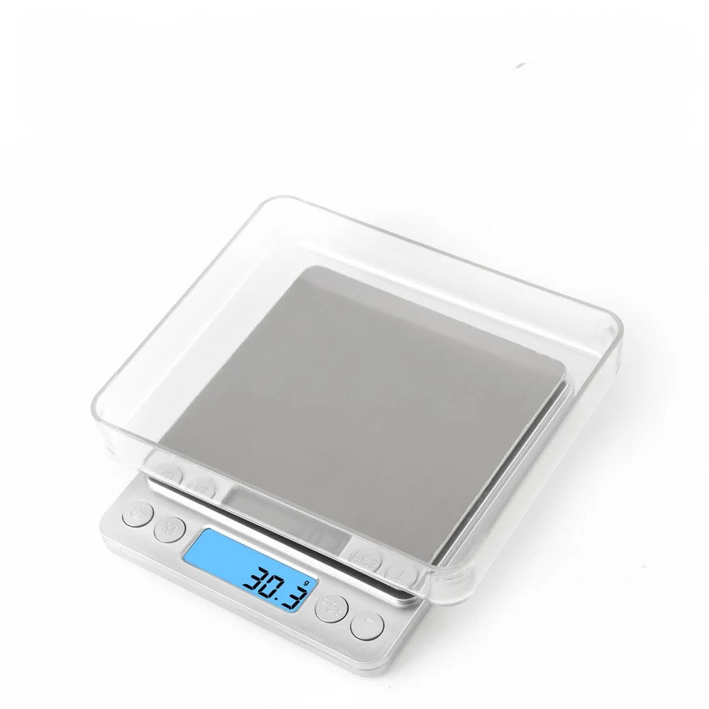 La balance de précision avec son couvercle